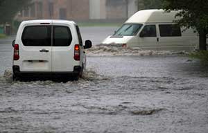 Commercial vehicles in the middle of a flood