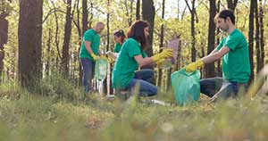 Nonprofit workers cleaning up a forest