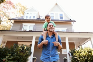 father and son outside home with Homeowners Insurance