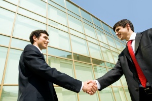 business men shaking hands after a deal for Insurance For Trade Associations