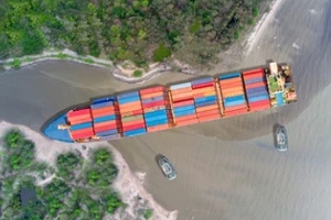cargo with containers entering the river with International Insurance