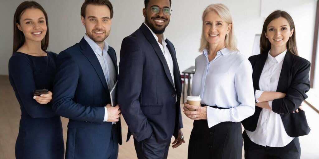 portrait of smiling successful multiracial international businesspeople