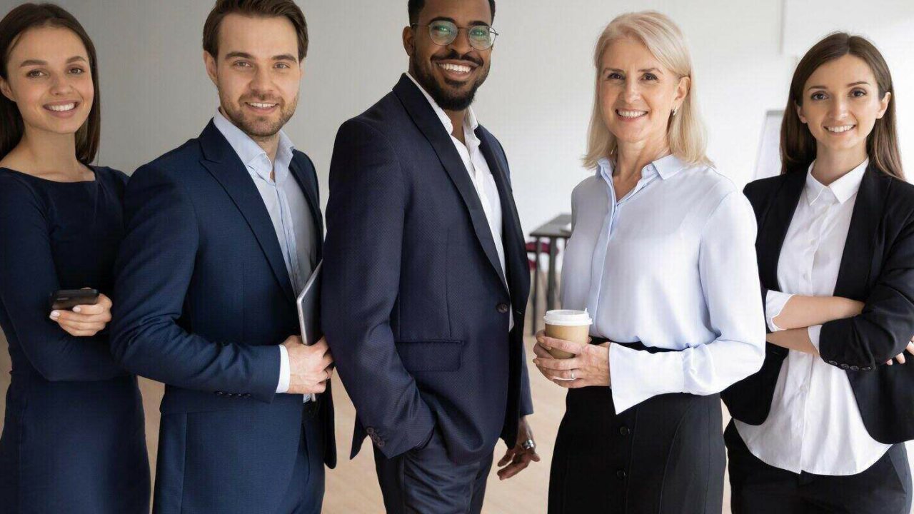 portrait of smiling successful multiracial international businesspeople