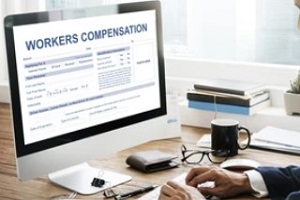 man checking workers compensation protection form online