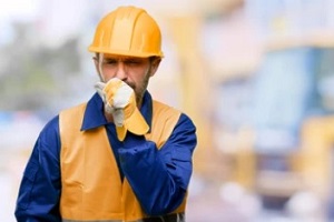 worker with dry cough at work with workers compensation protection