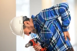 construction worker having sharp backpain