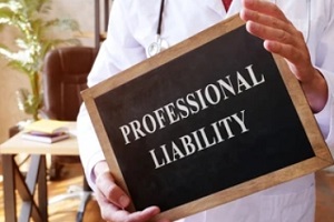 doctor holding professional liability board