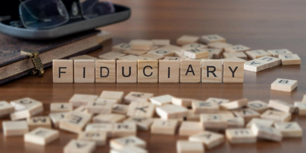 fiduciary word or concept represented by wooden letter tiles