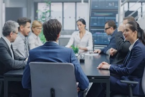 ceo and another employees in a meeting room