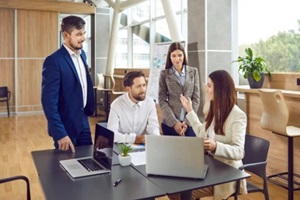 business people having work meeting around table in office interior