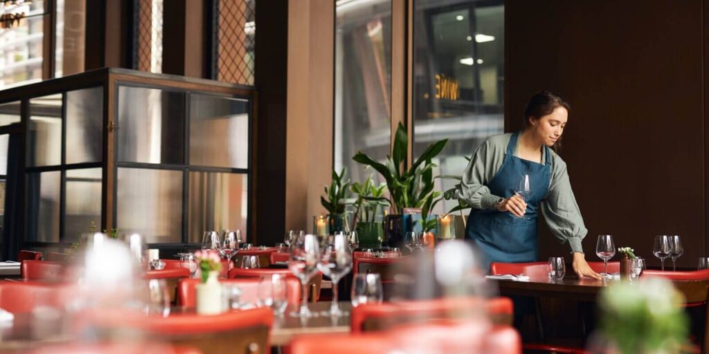 female waitress setting tables