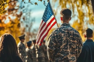 soldier in uniform holding American flag at ceremony