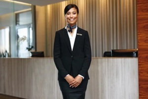 young asian woman working as a hotel receptionist