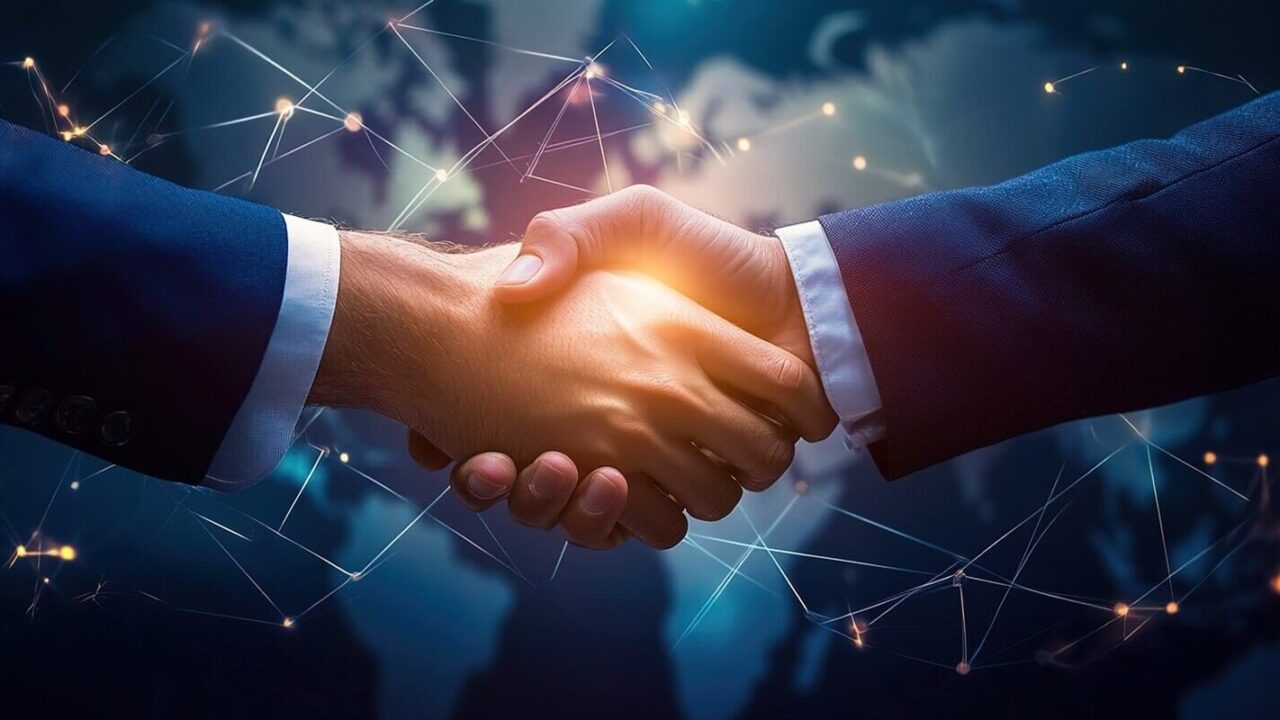 multinational team handshaking in modern office