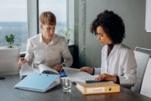 Agents Checking Insurance Documents