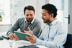 Business People Reviewing Coverage and Exclusions