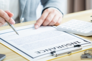 Government Contractor Checking Coverage in Insurance Document