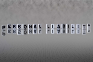 Personal Liability Concept Represented by Letter Cubes