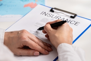 Government Contractor Signing an Insurance Document After Reading Details