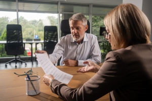 Government Contractor Discussing Policy with Insurance Agent