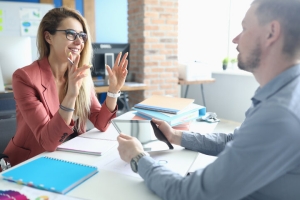 Businesswoman Asking Questions to E&O Insurance Agent
