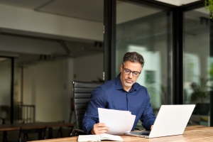 Businessman Checking E&O Coverage in Insurance Policy