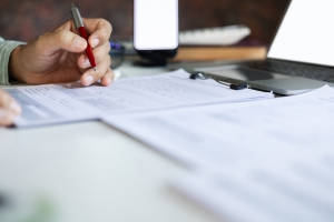 Businessman Reviewing E&O Insurance Documents for Reputation Management