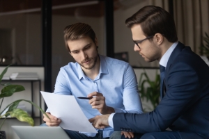 Event Planner Discussing Risk Management with Insurance Agent
