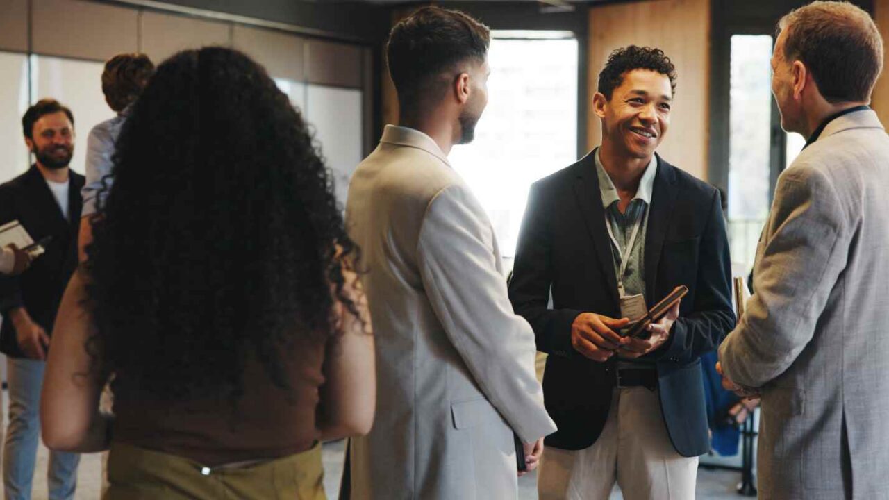 Event Planner Talking to Guest in an Networking Event